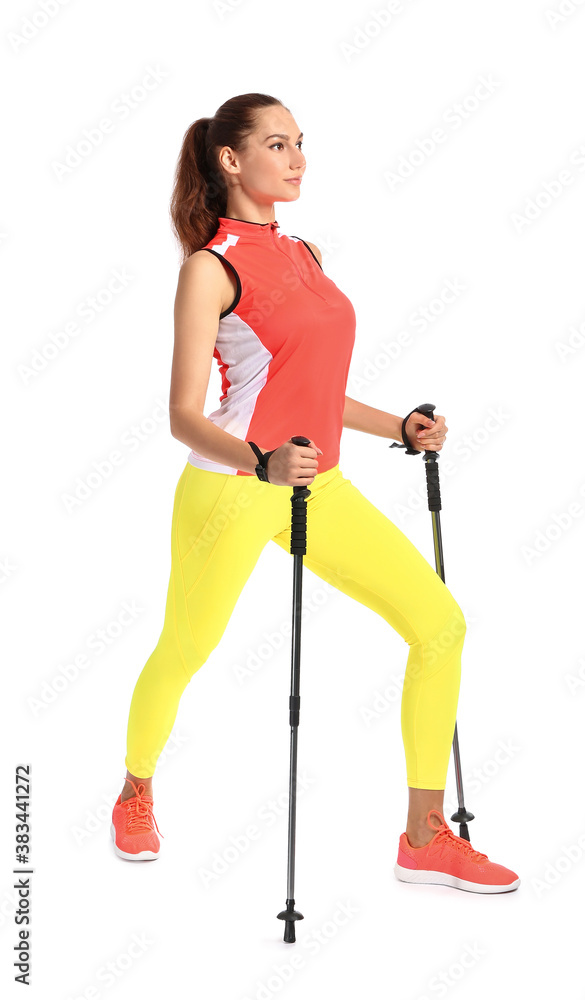 Young woman with walking poles on white background