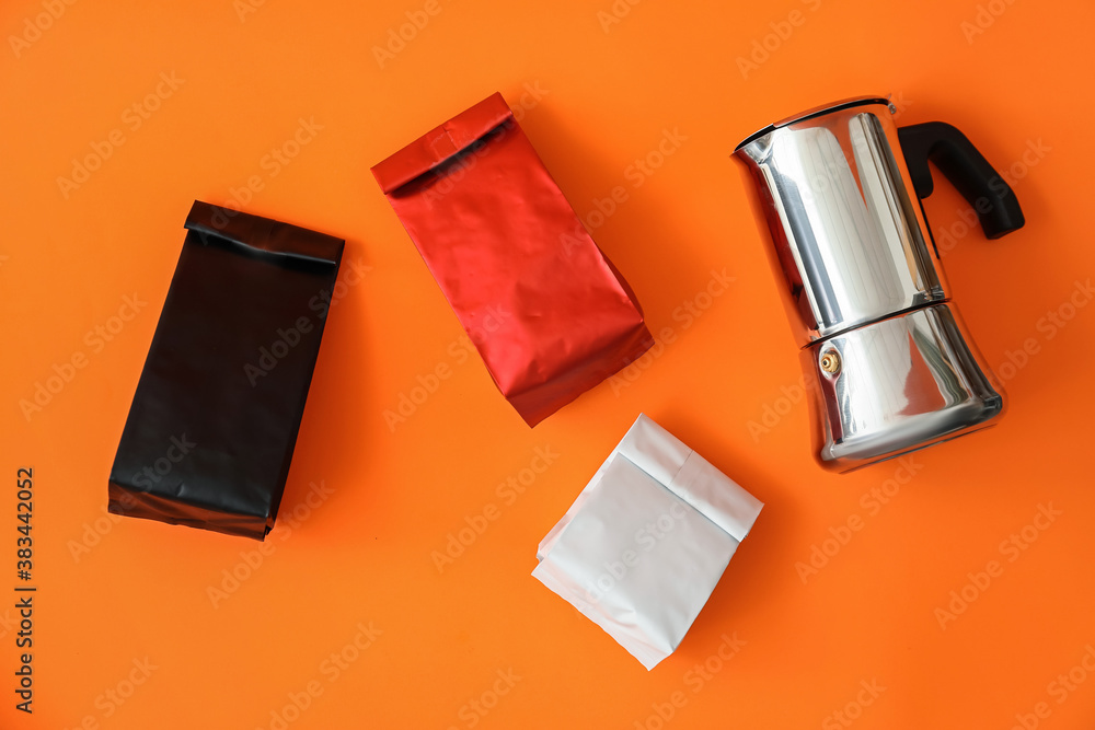 Blank bags with coffee pot on color background