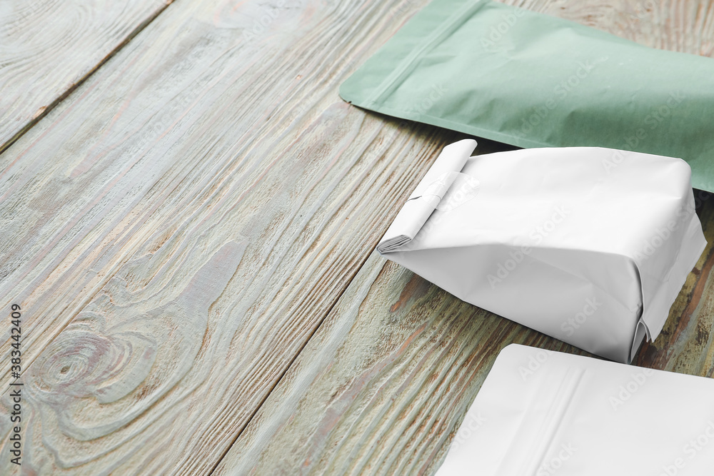 Blank bags on wooden background