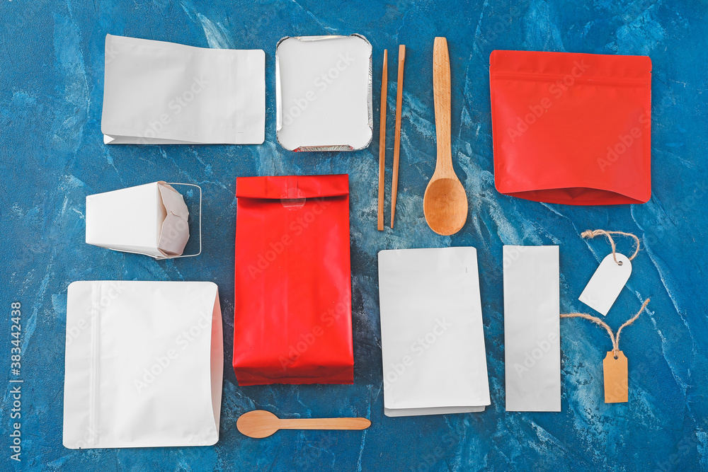 Packages for food on color background