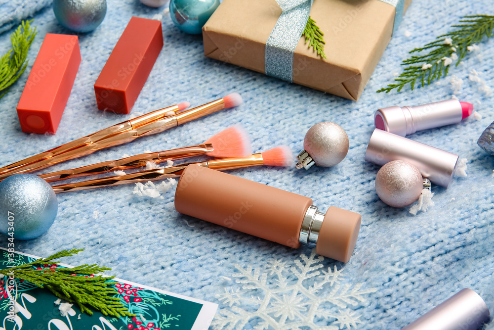 Christmas composition with cosmetics on color background