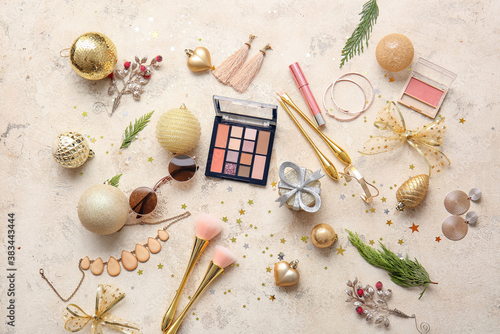 Christmas composition with cosmetics on light background