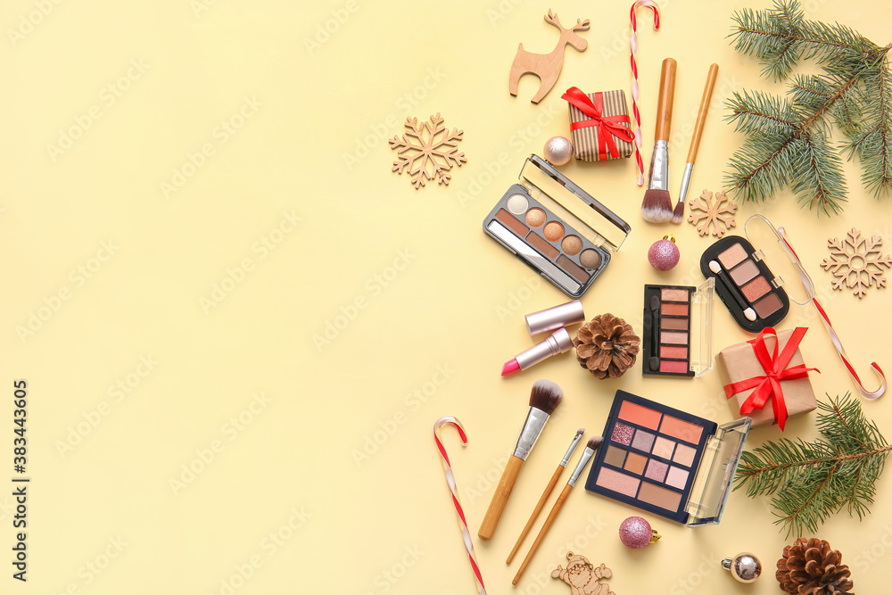 Christmas composition with cosmetics on color background