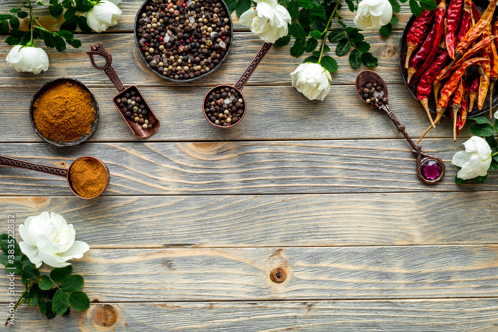 Set of hot Indian spices with flowers, top view