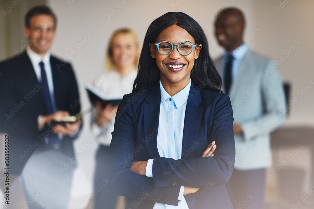 Young African businesswoman standing in an office