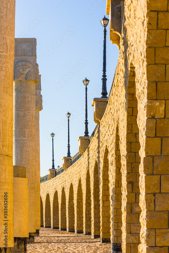 The arched stone colonnade with lanterns