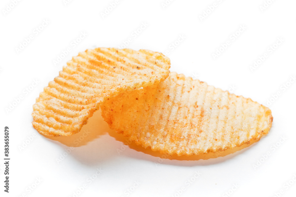 Two spiced potato chips on white background