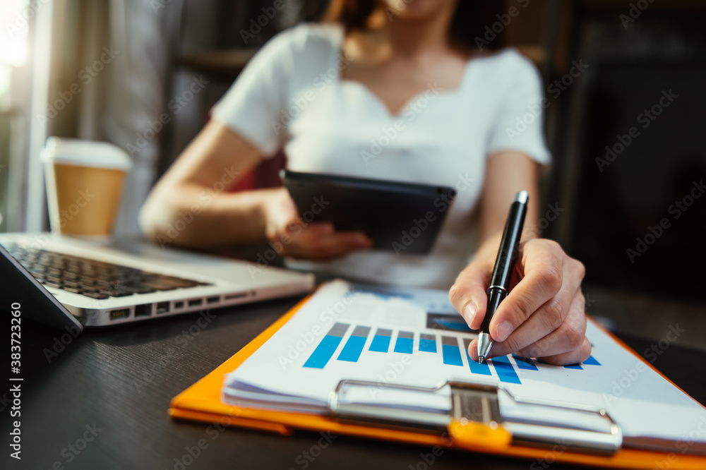 business woman hand working with laptop computer, tablet and smart phone in office with digital mark