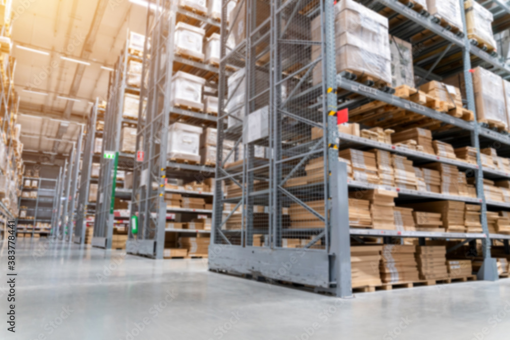 blurred background picture of  Rows of shelves with goods boxes in modern industry warehouse store a