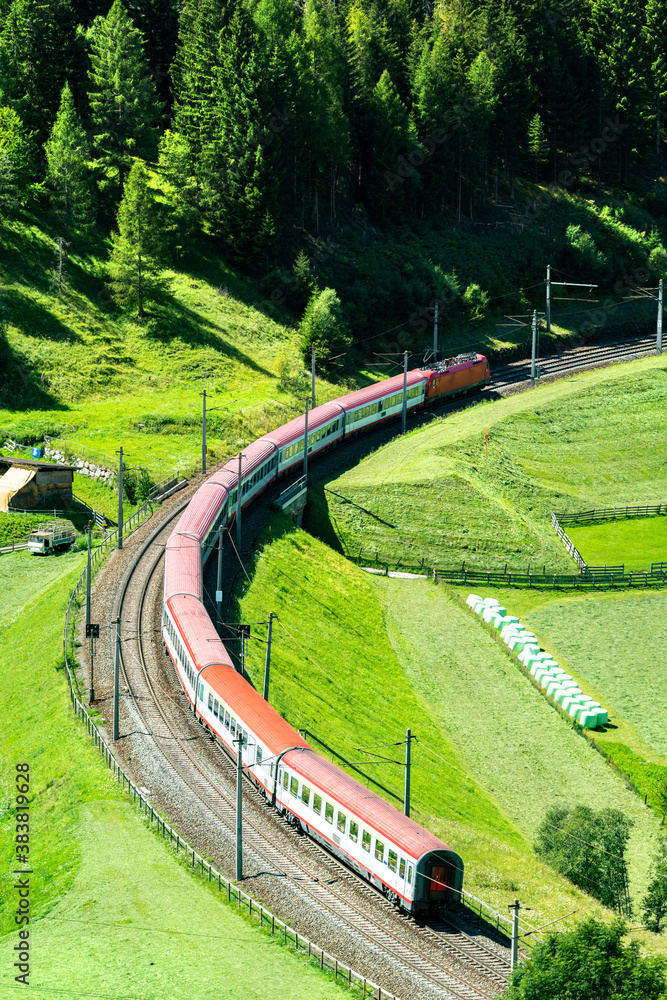 Passenger train at the Brenner Railway in the Austrian Alps