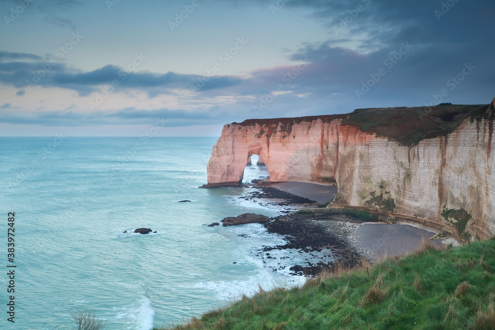 evening sunlight on cliffs in ocean