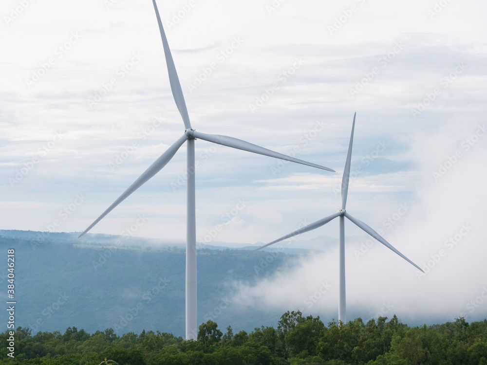 Large wind turbines with beautiful moving clouds, Wind turbine farm on beautiful cloudy sky, renewab