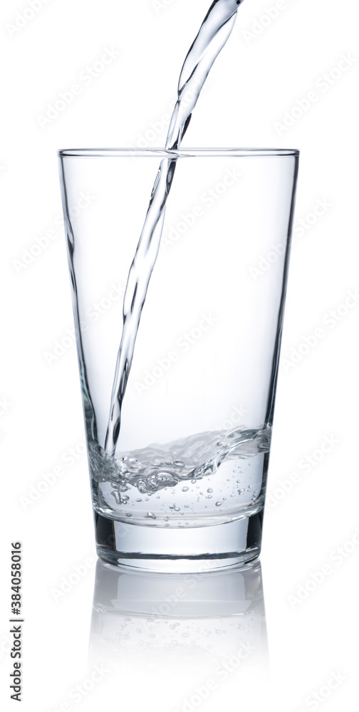 Pour water into a glass placed on a white background.