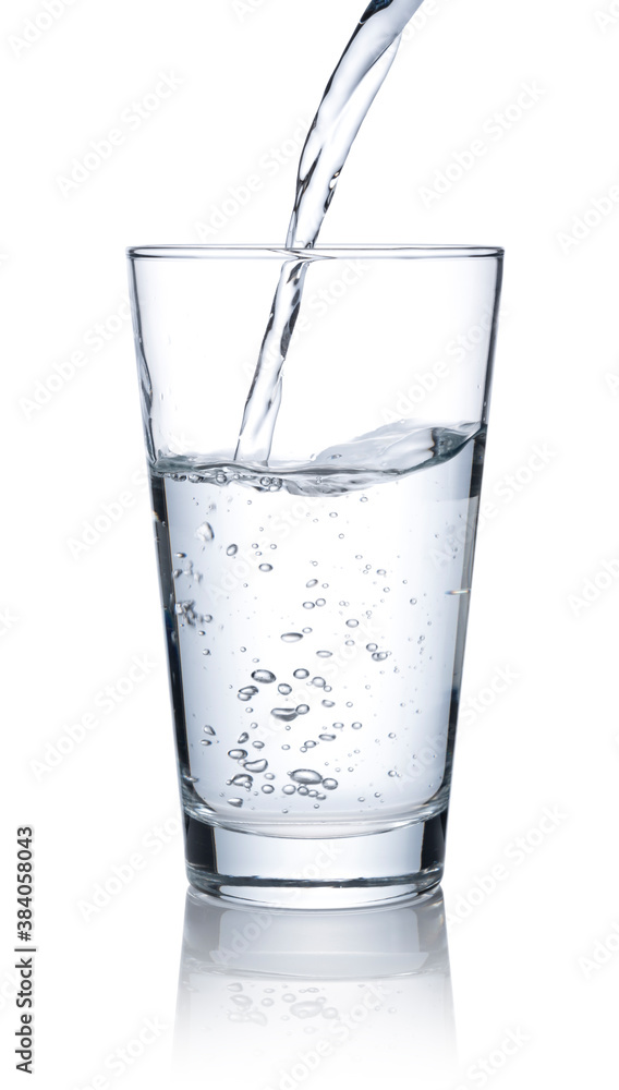 Pour water into a glass placed on a white background.