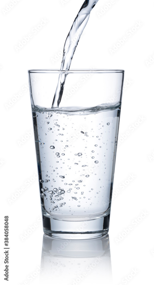 Pour water into a glass placed on a white background.