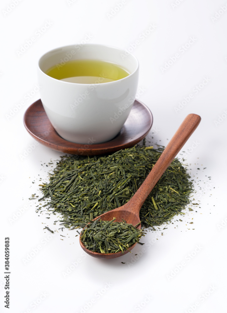 Green tea and tea leaves on a white background