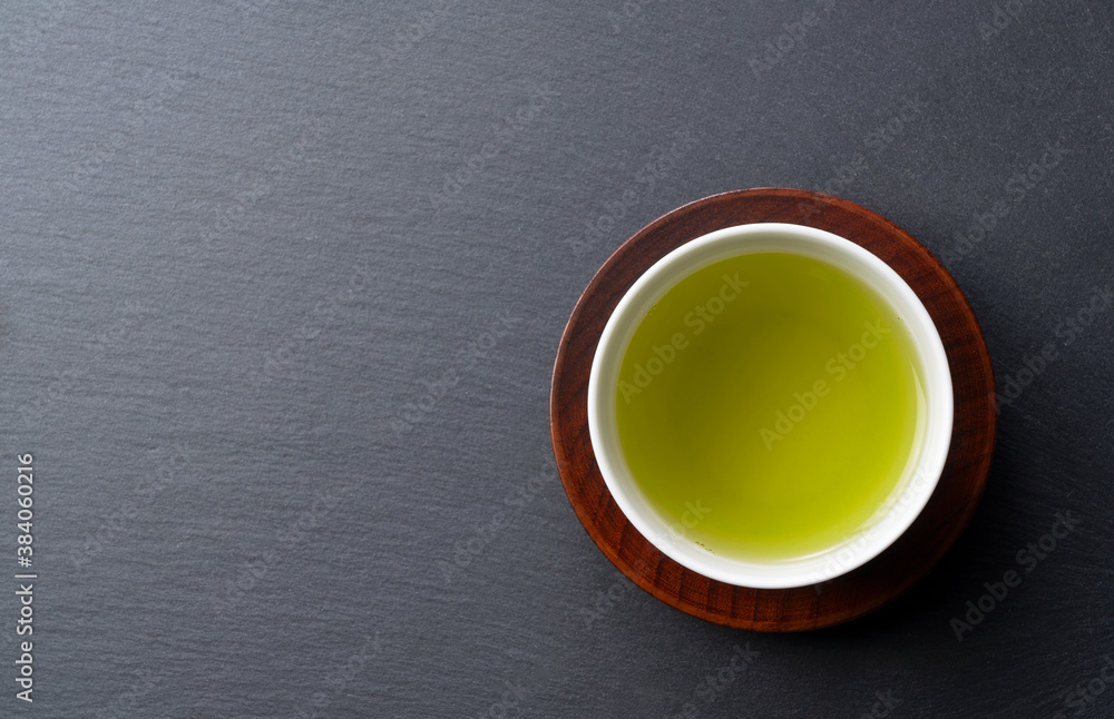 Green tea placed on a black background with space. Image of Japanese green tea