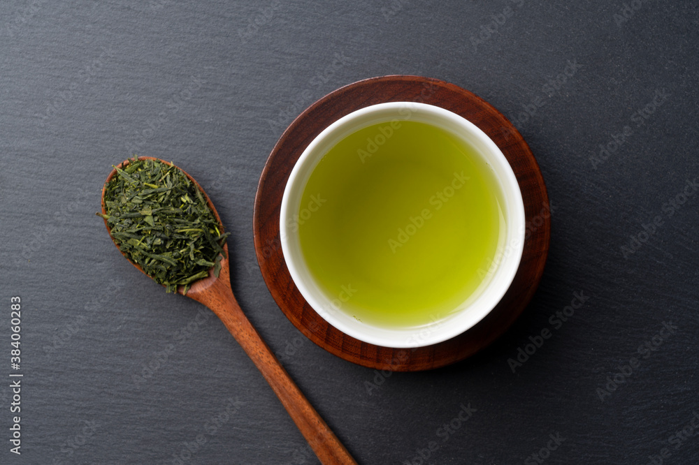 Green tea placed on a black background with space. Image of Japanese green tea