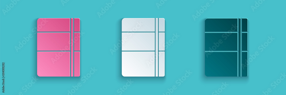 Paper cut Sketchbook or album icon isolated on blue background. Paper art style. Vector.