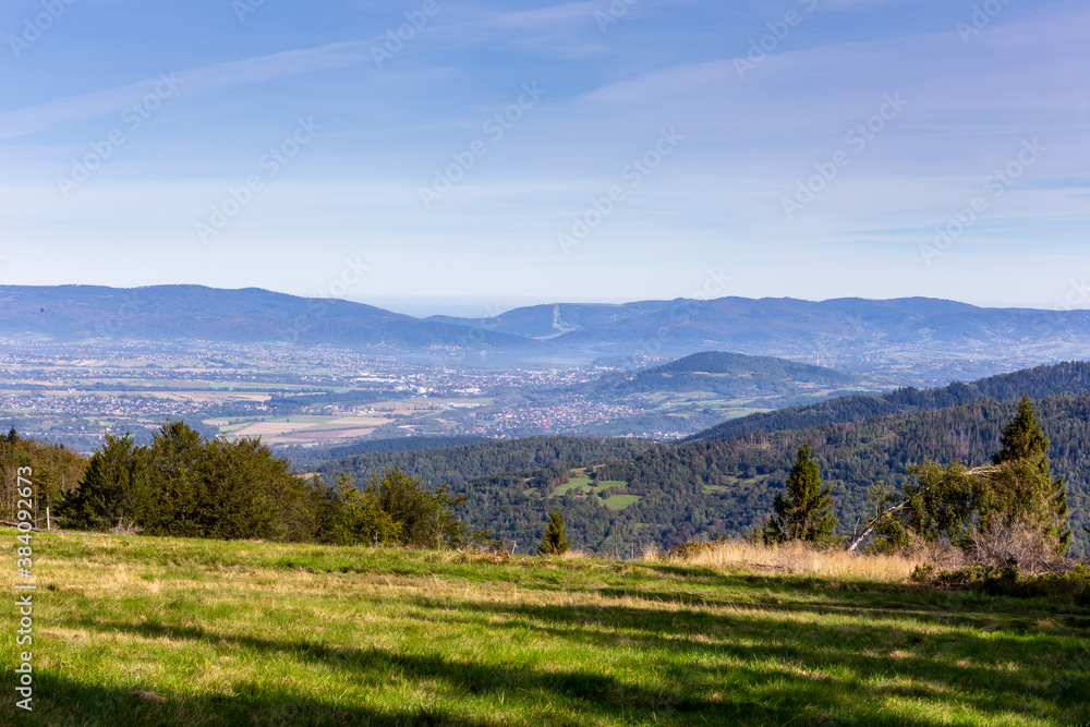 Zywiec Basin (Valley) landscape in Beskid Mountains, Poland, with green forests, meadows and Zywiec 