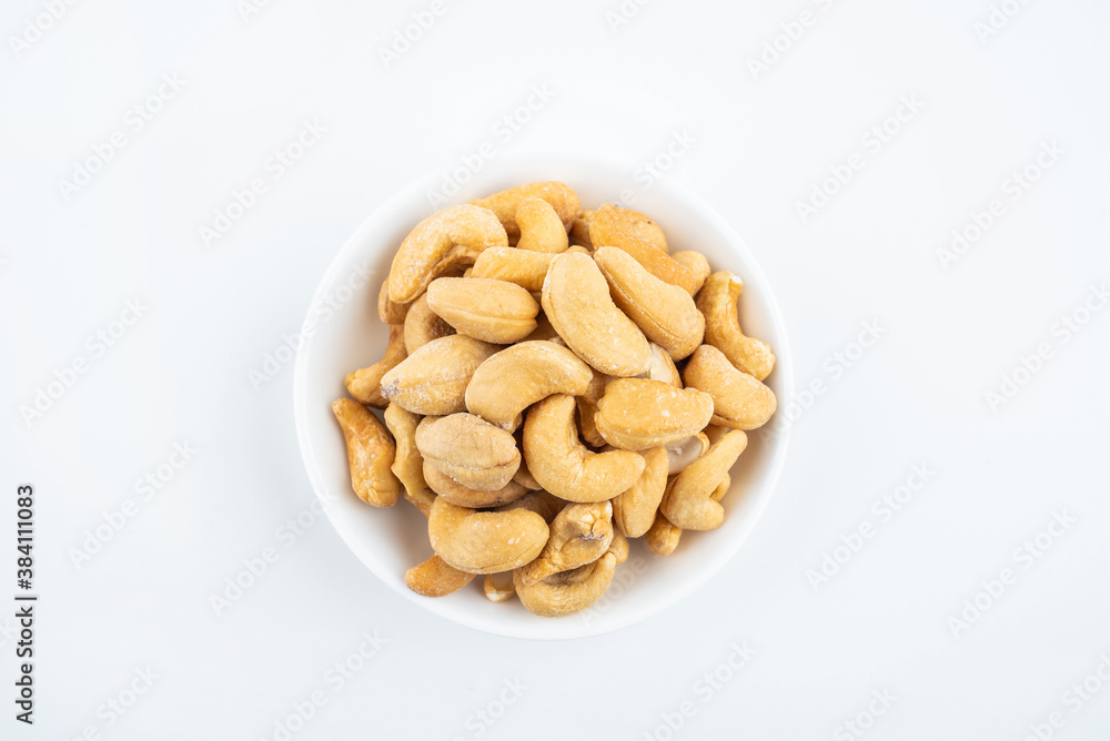 A plate of snacks with salted cashew nuts