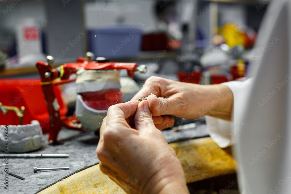 Close-up image of dentist working with drill and polisher.