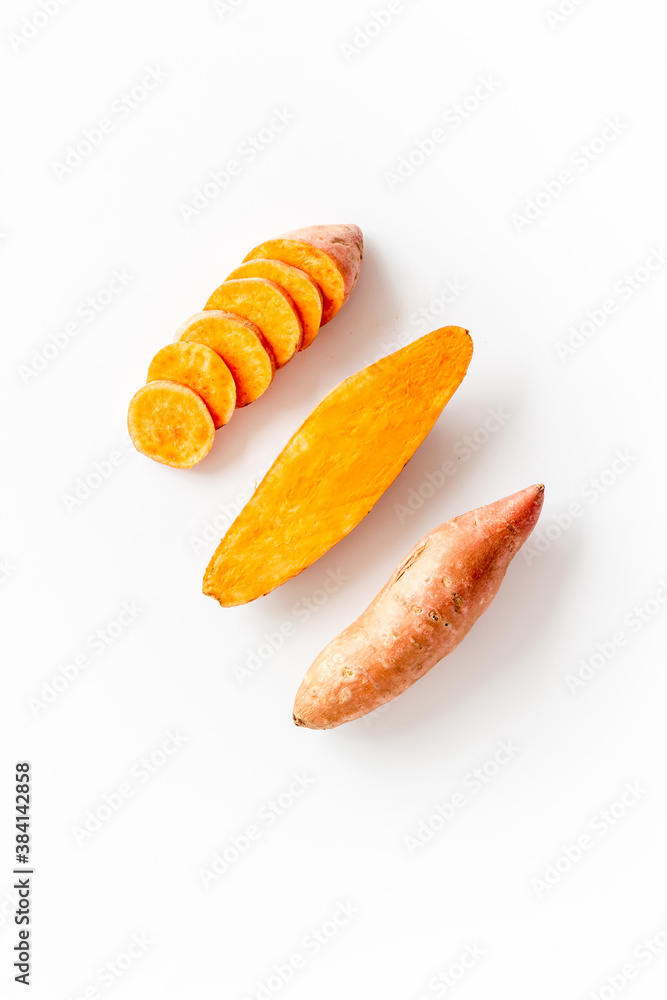 Raw sliced sweet potatoes - organic vegetables, top view