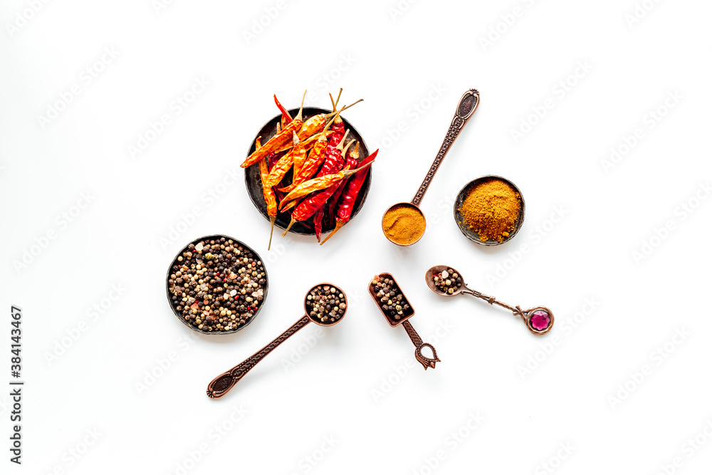 Overhead view of hot spice. Red pepper and paprika with cooking utensils