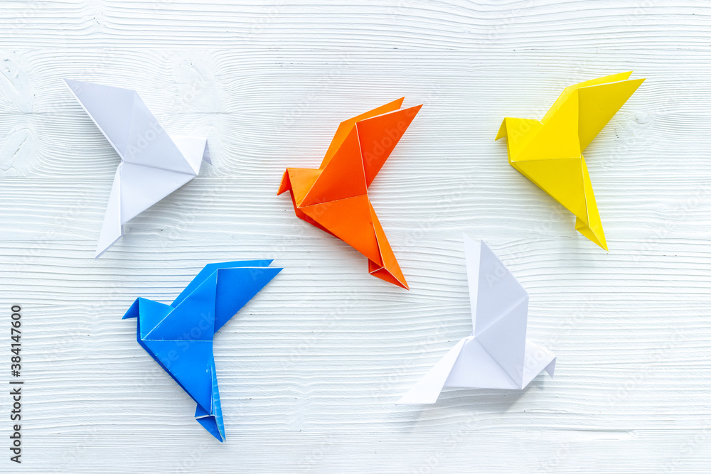 Paper birds of different shades. Origami concept. Top view