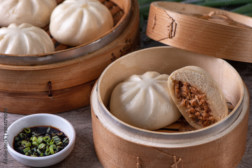 Close up of fresh delicious baozi, Chinese steamed meat bun.