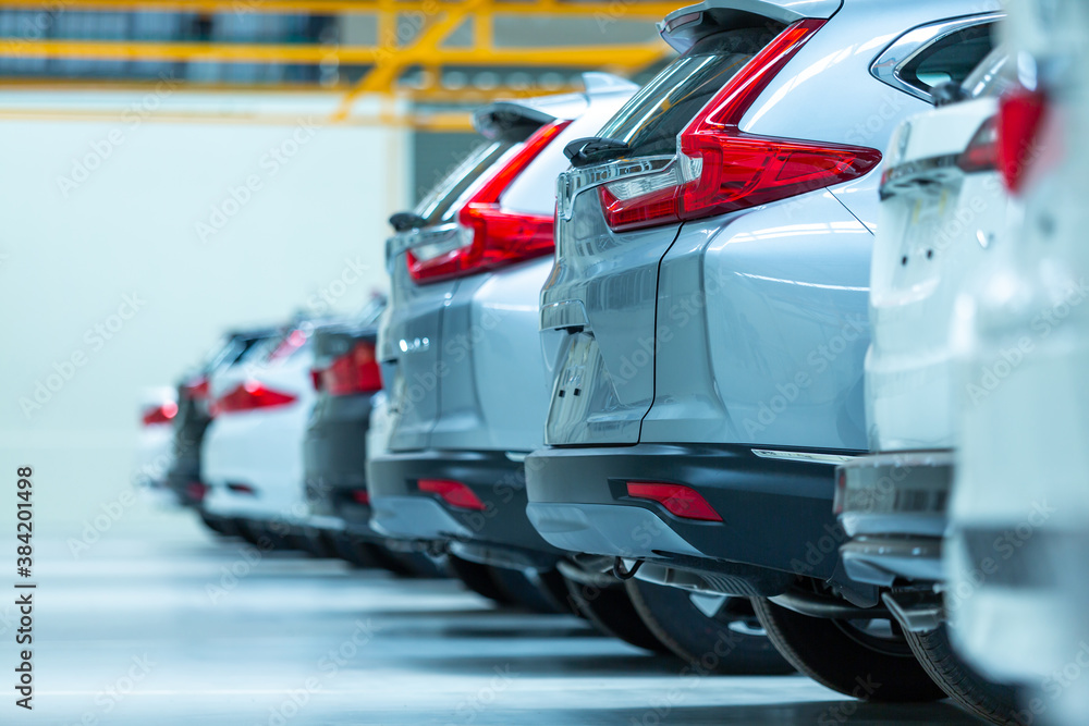 Cars For Sale, Automotive Industry, Cars Dealership Parking Lot. Rows of Brand New Vehicles Awaiting