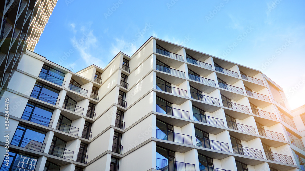 Apartment residential house and home facade architecture and outdoor facilities. Blue sky on the bac