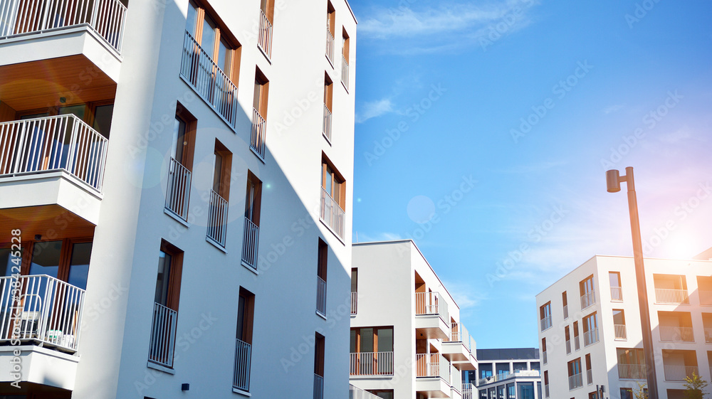 Apartment residential house and home facade architecture and outdoor facilities. Blue sky on the bac