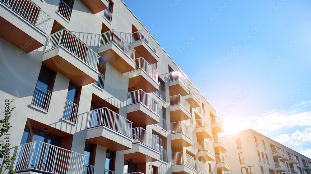 Apartment residential house and home facade architecture and outdoor facilities. Blue sky on the bac