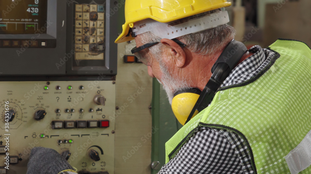 Senior factory worker or engineer close up portrait in factory . Industry and engineering concept .