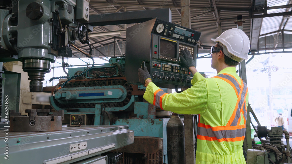 Smart factory worker using machine in factory workshop . Industry and engineering concept.