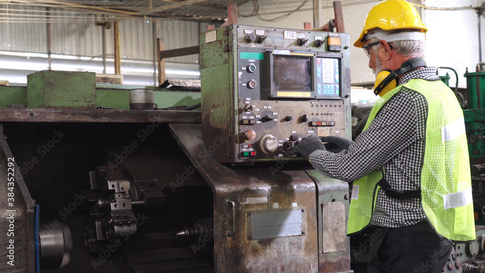 Smart factory worker using machine in factory workshop . Industry and engineering concept.