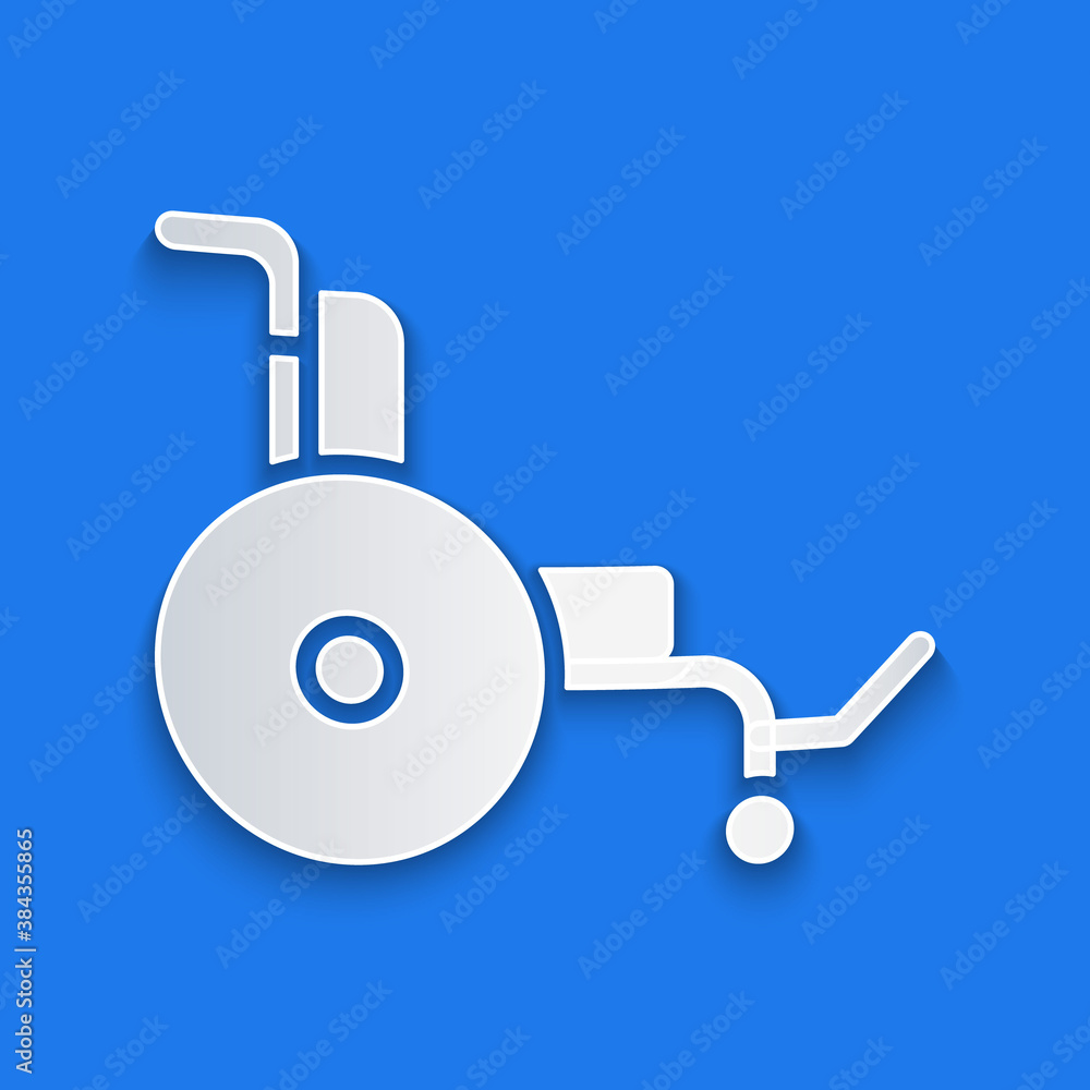 Paper cut Wheelchair for disabled person icon isolated on blue background. Paper art style. Vector.