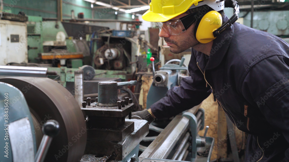 Smart factory worker using machine in factory workshop . Industry and engineering concept.