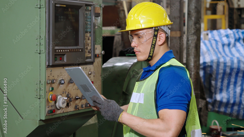 Smart factory worker using machine in factory workshop . Industry and engineering concept.