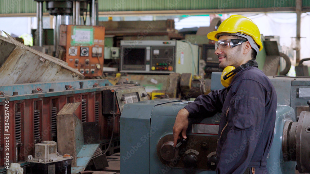 Smart factory worker using machine in factory workshop . Industry and engineering concept.