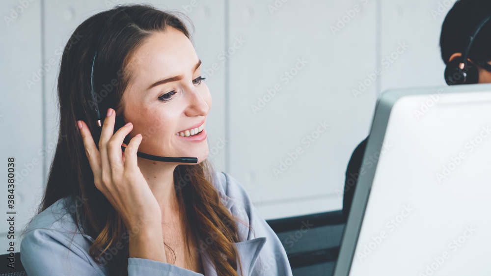 Business people wearing headset working in office to support remote customer or colleague. Call cent