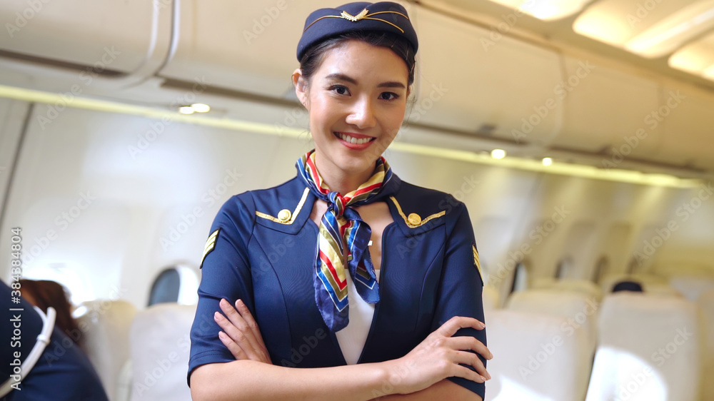 Cabin crew or air hostess working in airplane . Airline transportation and tourism concept.