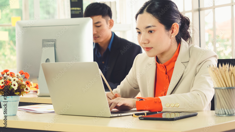 Business people working at table in modern office room while analyzing financial data report .