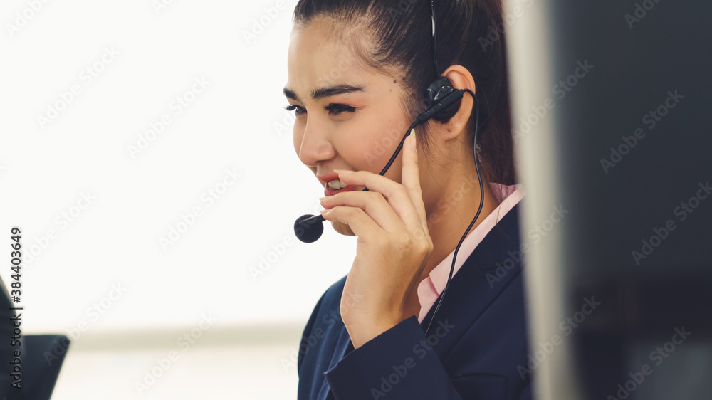 Business people wearing headset working in office to support remote customer or colleague. Call cent