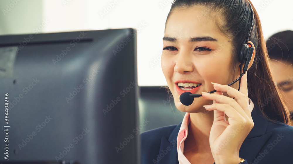 Business people wearing headset working in office to support remote customer or colleague. Call cent