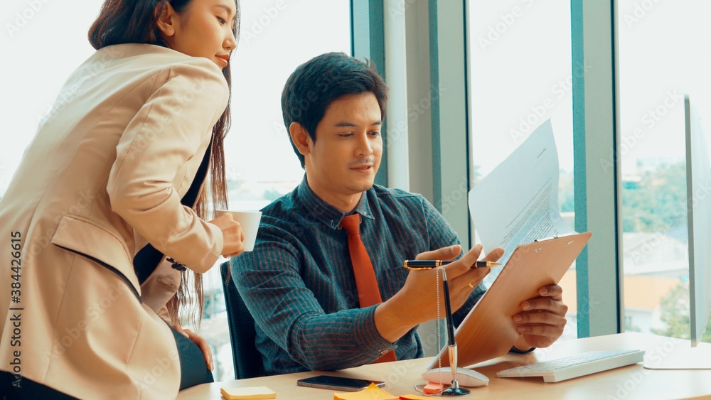 Two business people talk project strategy at office meeting room. Businessman discuss project planni