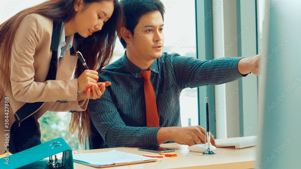 Two business people talk project strategy at office meeting room. Businessman discuss project planni