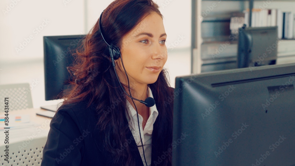 Business people wearing headset working in office to support remote customer or colleague. Call cent