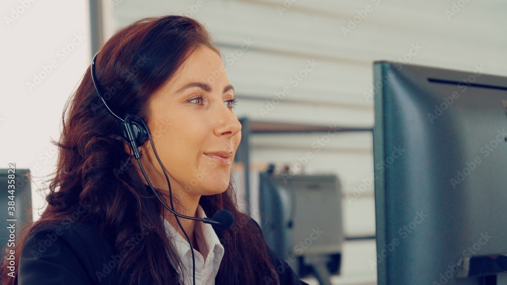 Business people wearing headset working in office to support remote customer or colleague. Call cent